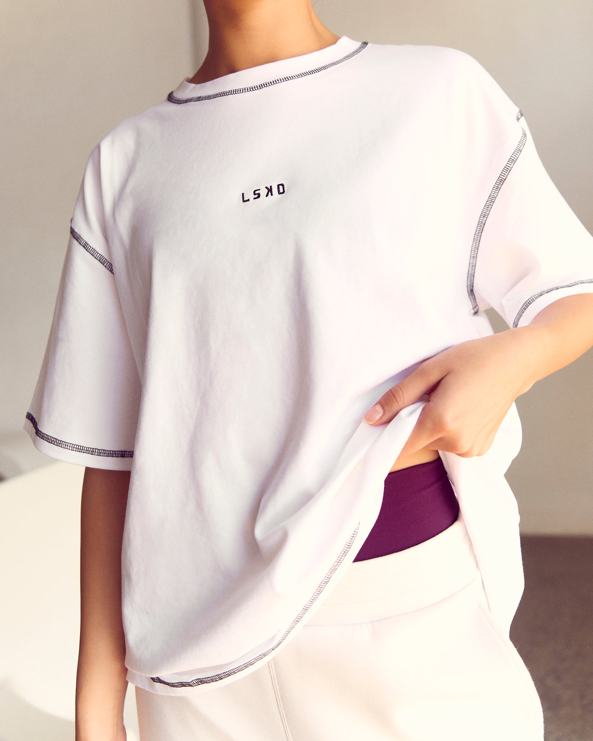Woman wearing Go-To Contrast Oversized Heavyweight FLXCotton Tee - White-Black | Model:Kenni | Size:XS - view 2