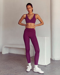 Woman wearing Vitality Sports Bra - Plum Caspia | Model:Kenni | Size:XS | Thumbnail Index: 4