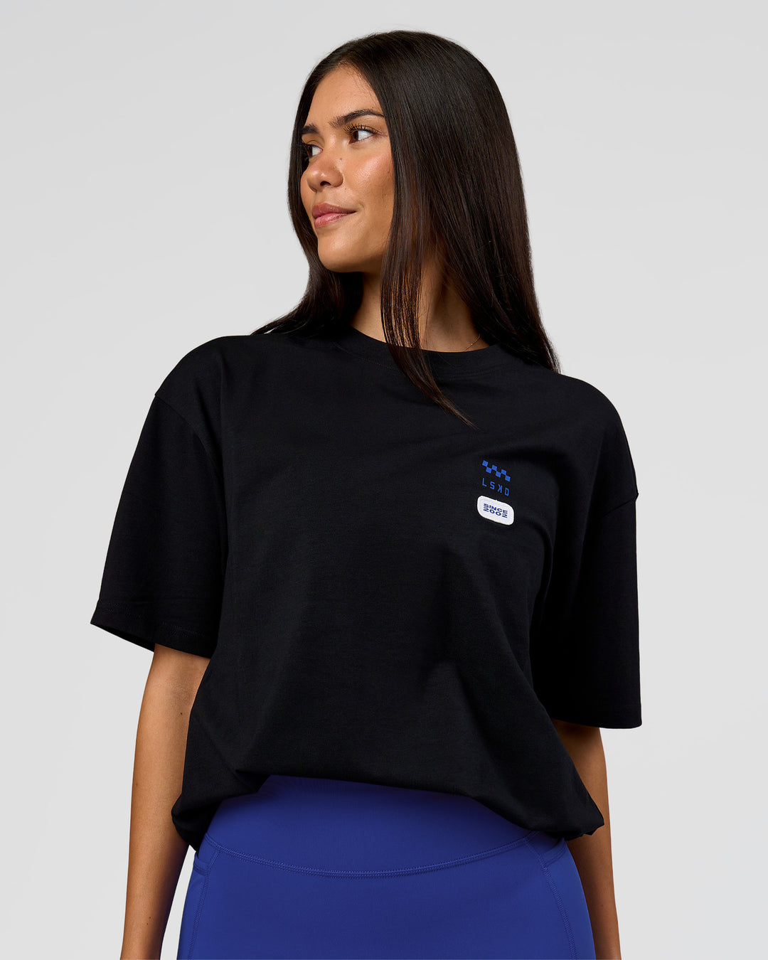 Woman wearing Archive FLXCotton Oversized Tee - Black-Electric Indigo | Model:Rhiley | Size:XS - view 5