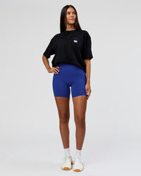 Woman wearing Archive FLXCotton Oversized Tee - Black-Electric Indigo | Model:Rhiley | Size:XS | Thumbnail Index: 8