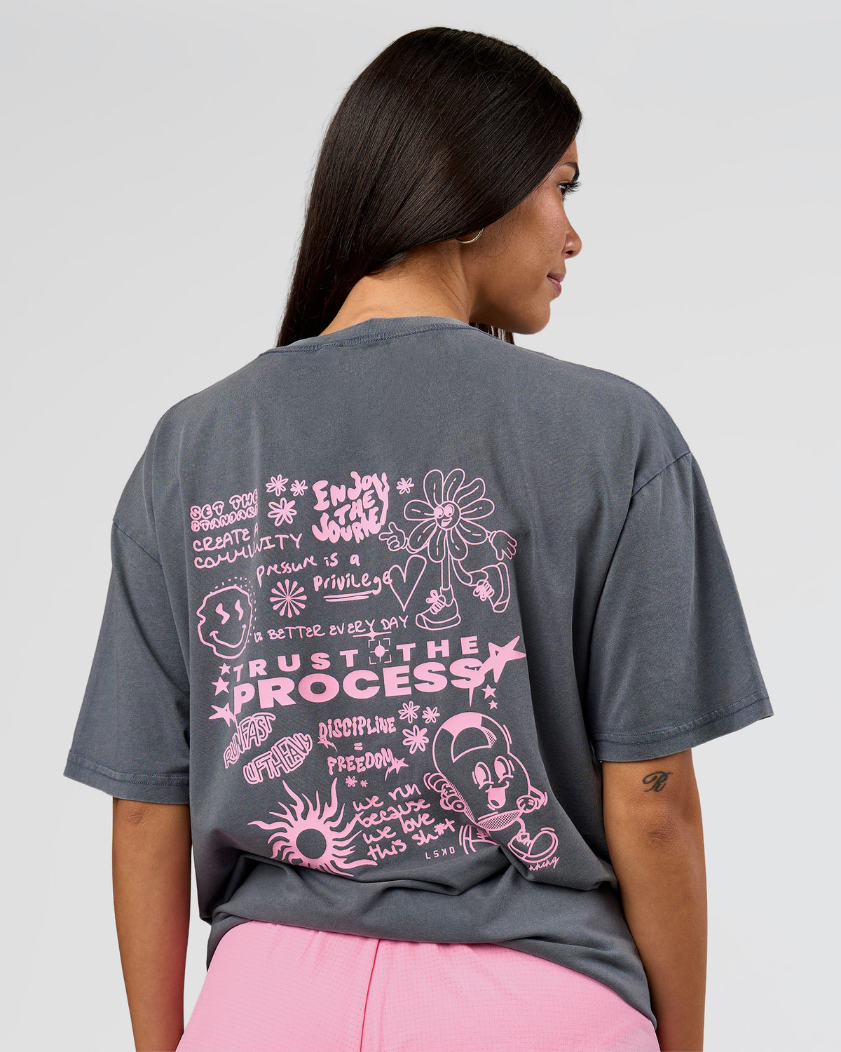 Woman wearing Built On Values FLXCotton Oversized Tee - Dark Storm Washed-Pink Rose | Model:Rhiley | Size:XS