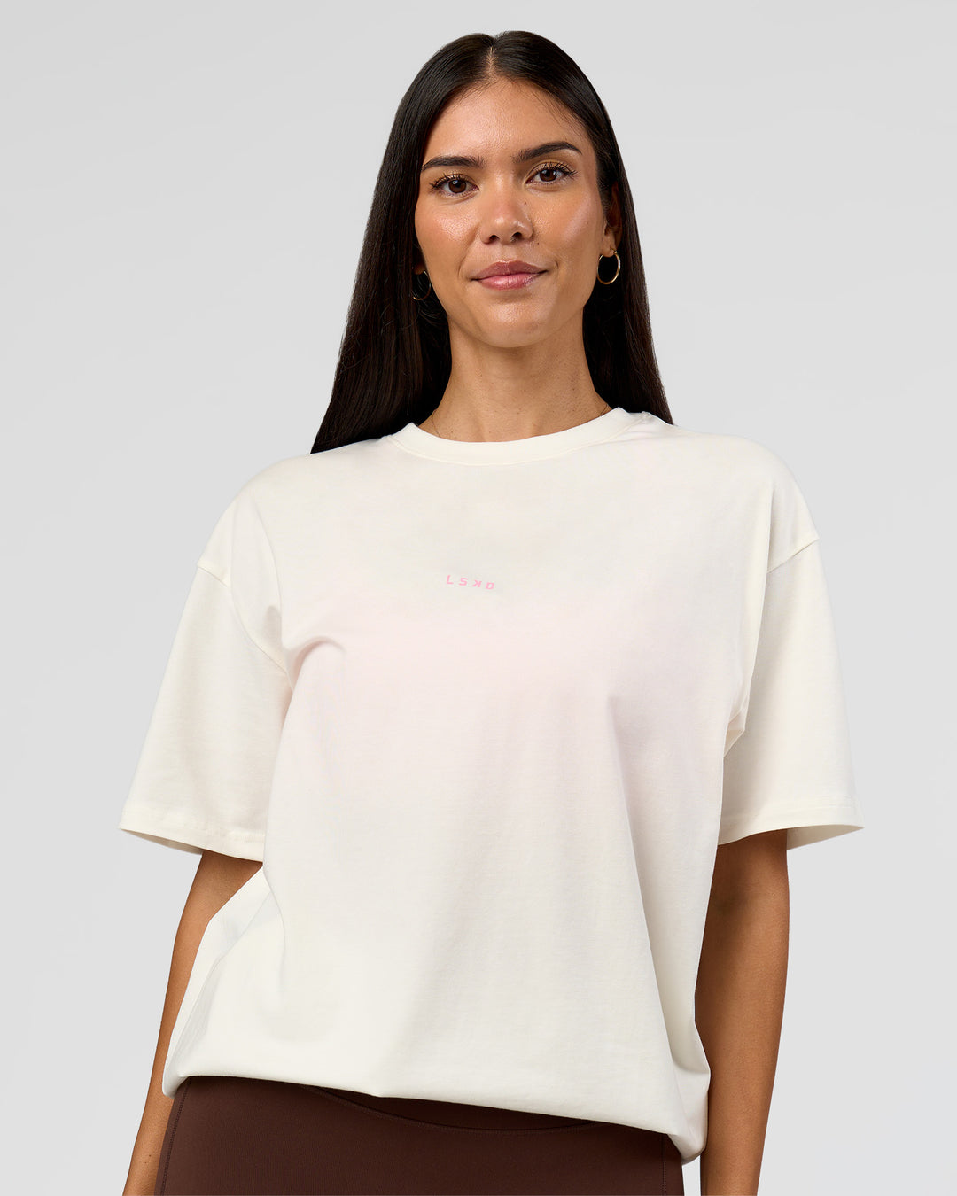 Woman wearing Built On Values FLXCotton Oversized Tee - Off White-Pink Rose | Model:Rhiley | Size:XS - view 13