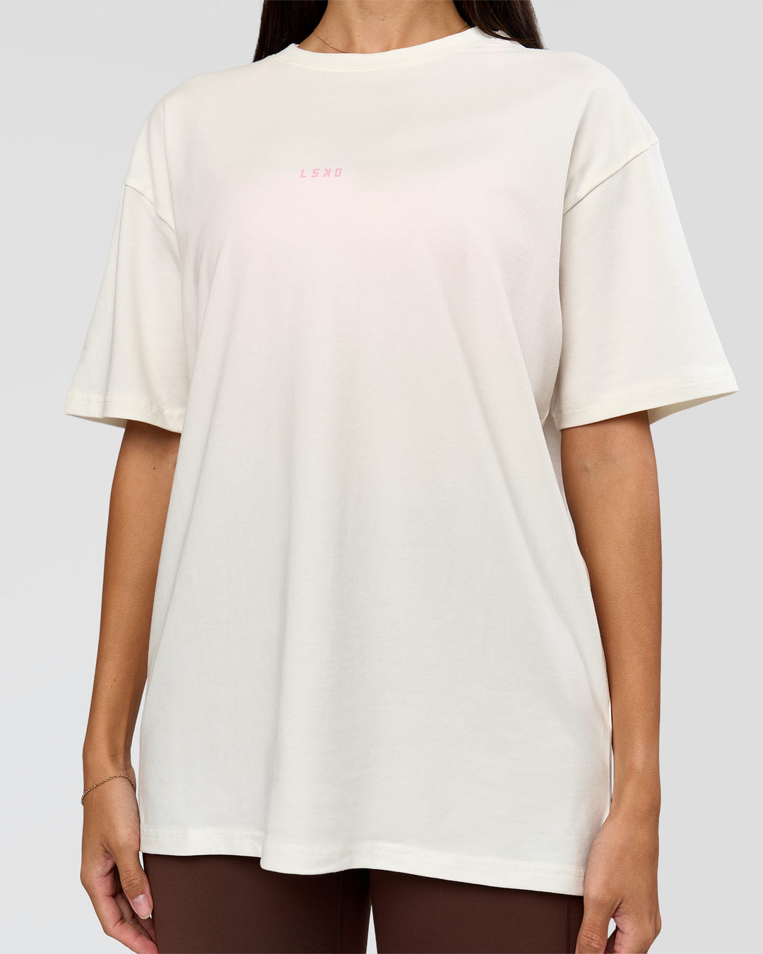 Woman wearing Built On Values FLXCotton Oversized Tee - Off White-Pink Rose | Model:Rhiley | Size:XS - view 14