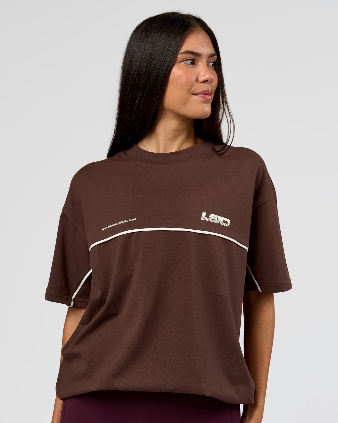 Woman wearing Inline Heavyweight FLXCotton Oversized Tee - Hot Chocolate-Off White | Model:Rhiley | Size:XS - view 7
