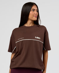Woman wearing Inline Heavyweight FLXCotton Oversized Tee - Hot Chocolate-Off White | Model:Rhiley | Size:XS | Thumbnail Index: 6