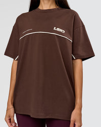 Woman wearing Inline Heavyweight FLXCotton Oversized Tee - Hot Chocolate-Off White | Model:Rhiley | Size:XS | Thumbnail Index: 9
