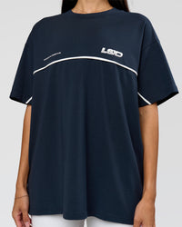 Woman wearing Inline Heavyweight FLXCotton Oversized Tee - Midnight Navy-White | Model:Rhiley | Size:XS | Thumbnail Index: 3