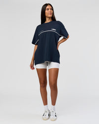 Woman wearing Inline Heavyweight FLXCotton Oversized Tee - Midnight Navy-White | Model:Rhiley | Size:XS | Thumbnail Index: 12