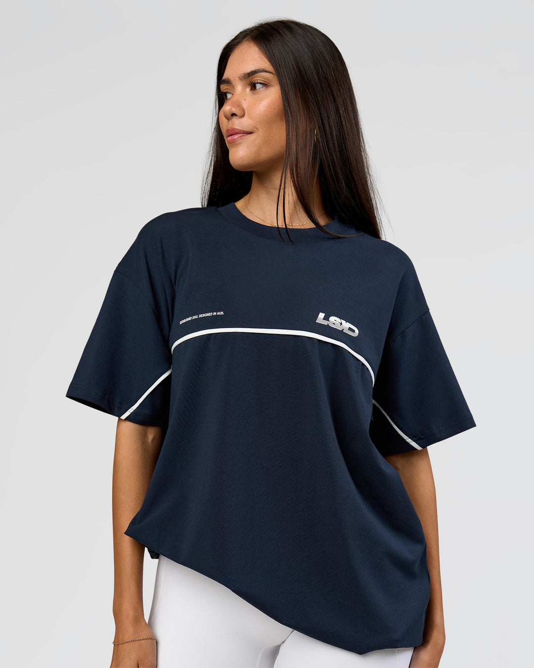 Woman wearing Inline Heavyweight FLXCotton Oversized Tee - Midnight Navy-White | Model:Rhiley | Size:XS - view 16