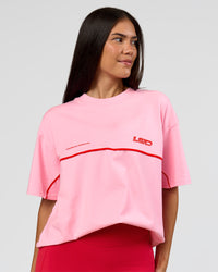 Woman wearing Inline Heavyweight FLXCotton Oversized Tee - Pink Rose-Flame | Model:Rhiley | Size:XS | Thumbnail Index: 5