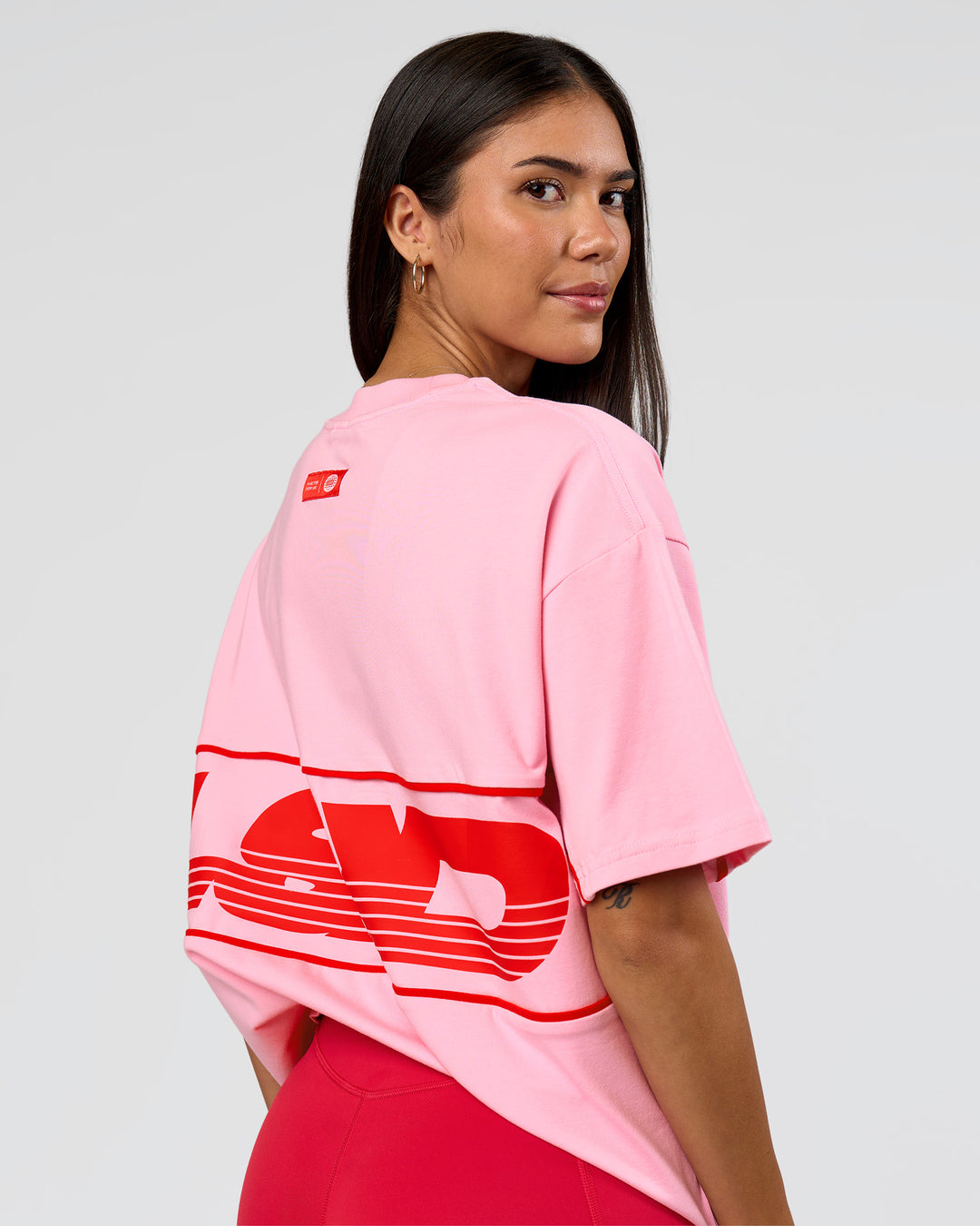 Woman wearing Inline Heavyweight FLXCotton Oversized Tee - Pink Rose-Flame | Model:Rhiley | Size:XS - view 9