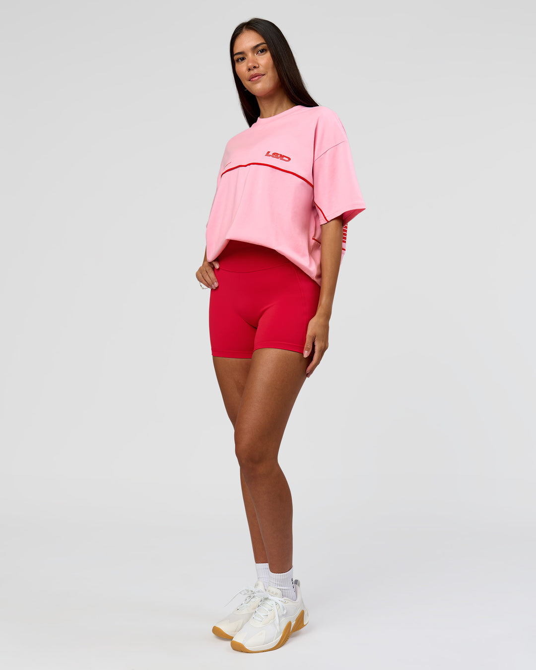 Woman wearing Inline Heavyweight FLXCotton Oversized Tee - Pink Rose-Flame | Model:Rhiley | Size:XS - view 15