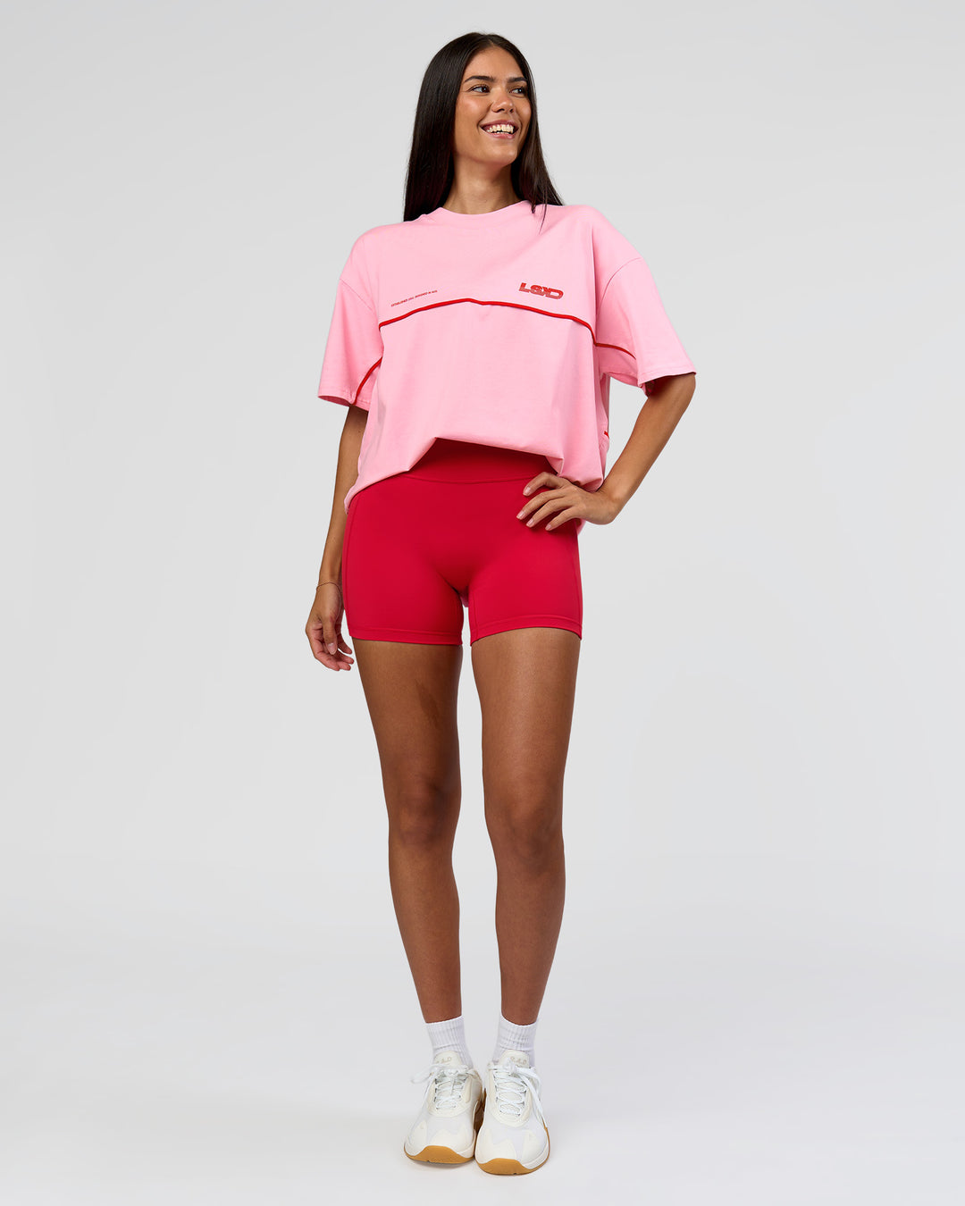 Woman wearing Inline Heavyweight FLXCotton Oversized Tee - Pink Rose-Flame | Model:Rhiley | Size:XS - view 18