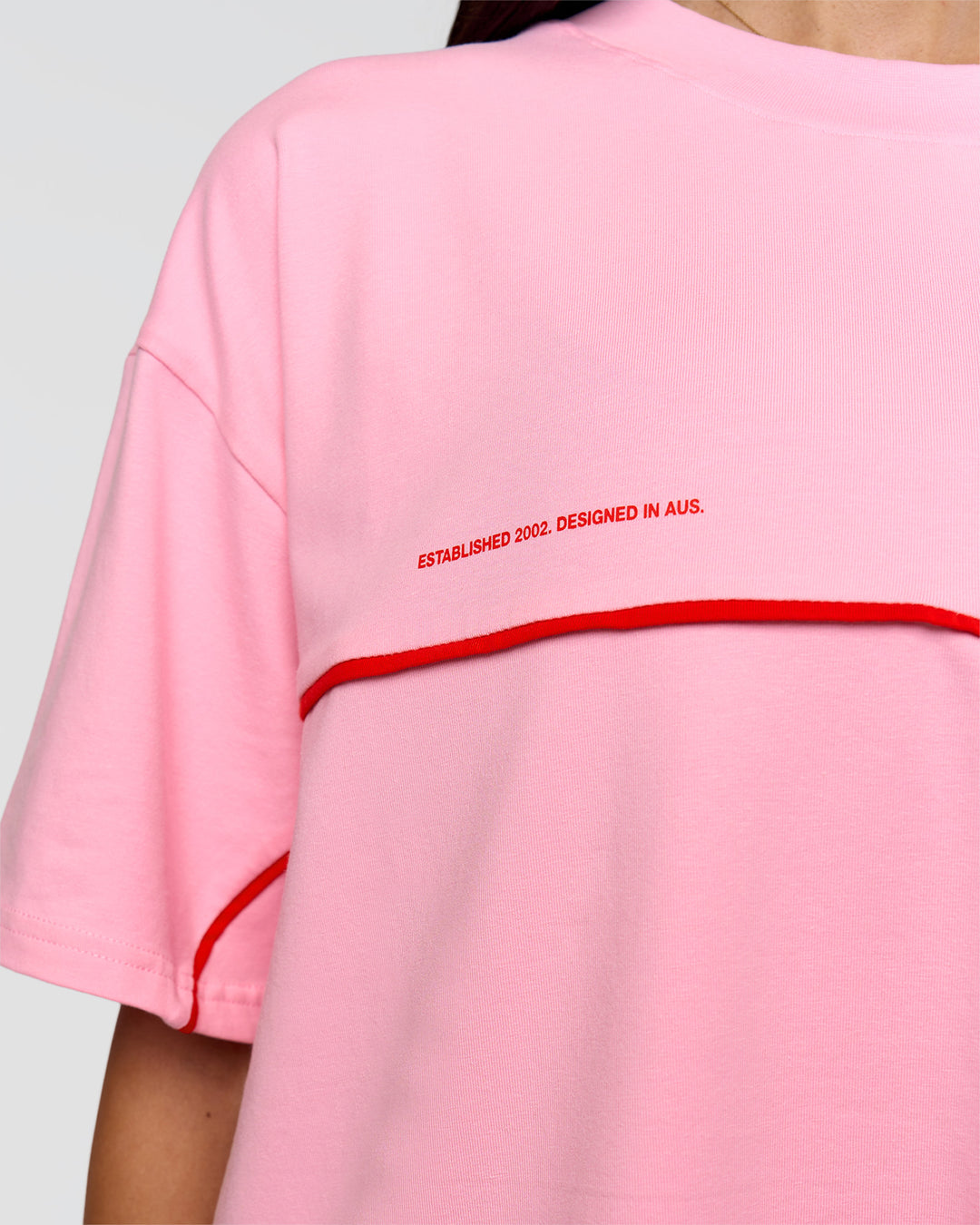 Woman wearing Inline Heavyweight FLXCotton Oversized Tee - Pink Rose-Flame | Model:Rhiley | Size:XS - view 22