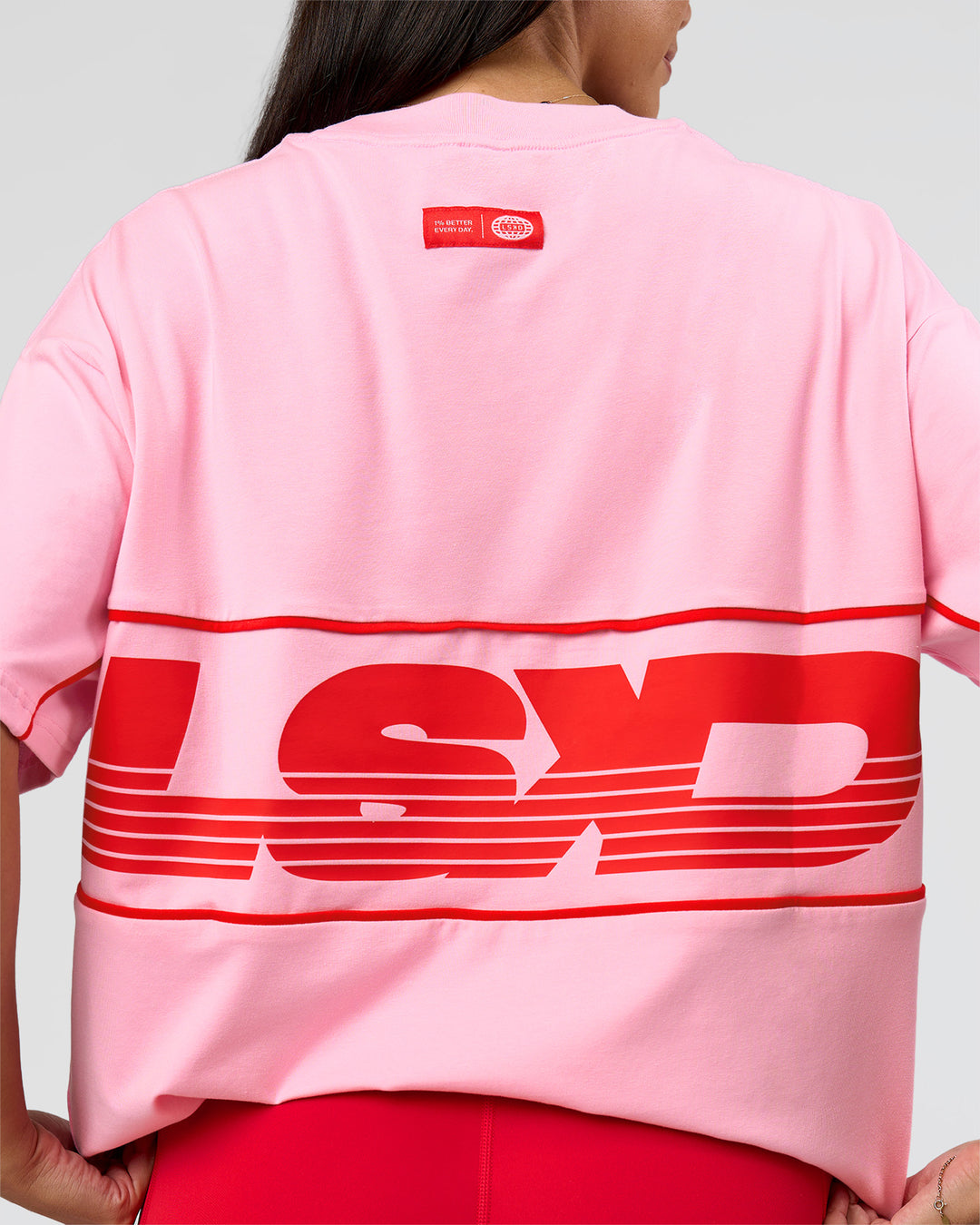 Woman wearing Inline Heavyweight FLXCotton Oversized Tee - Pink Rose-Flame | Model:Rhiley | Size:XS - view 23