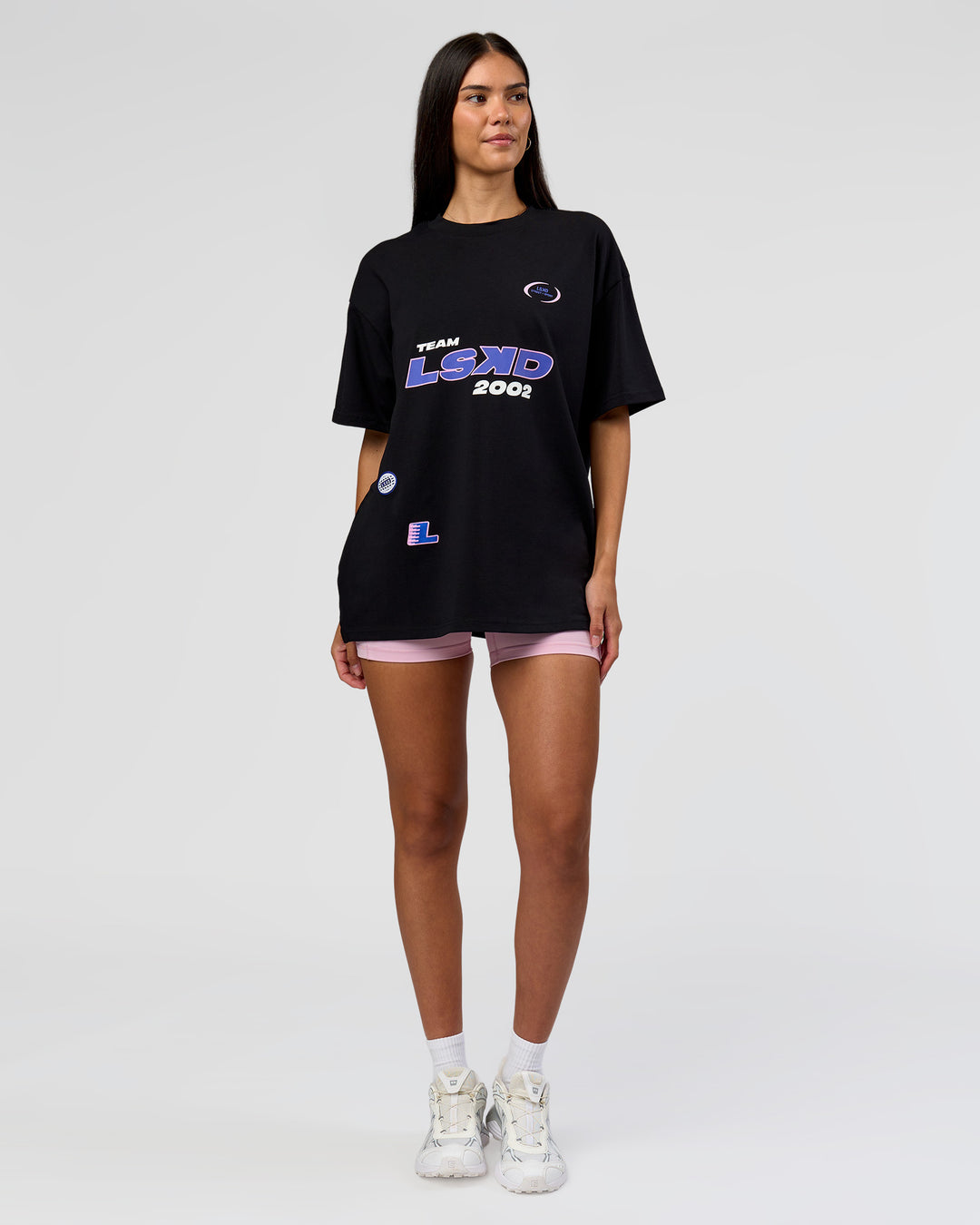 Woman wearing League Heavyweight FLXCotton Oversized Tee - Black-Power Cobalt | Model:Rhiley | Size:XS - view 9