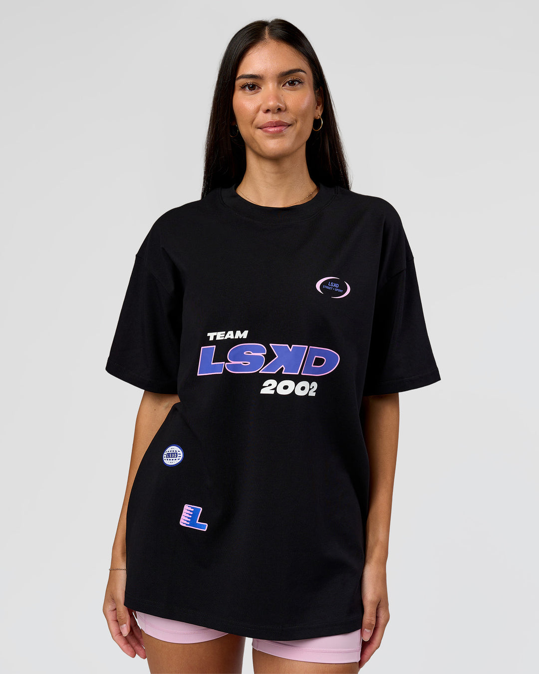 Woman wearing League Heavyweight FLXCotton Oversized Tee - Black-Power Cobalt | Model:Rhiley | Size:XS - view 6