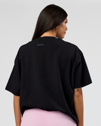 Woman wearing League Heavyweight FLXCotton Oversized Tee - Black-Power Cobalt | Model:Rhiley | Size:XS | Thumbnail Index: 14