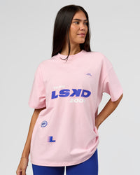 Woman wearing League Heavyweight FLXCotton Oversized Tee - Marshmallow-Power Cobalt | Model:Rhiley | Size:XS | Thumbnail Index: 6
