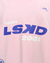 Woman wearing League Heavyweight FLXCotton Oversized Tee - Marshmallow-Power Cobalt | Model:Rhiley | Size:XS | Thumbnail Index: 17