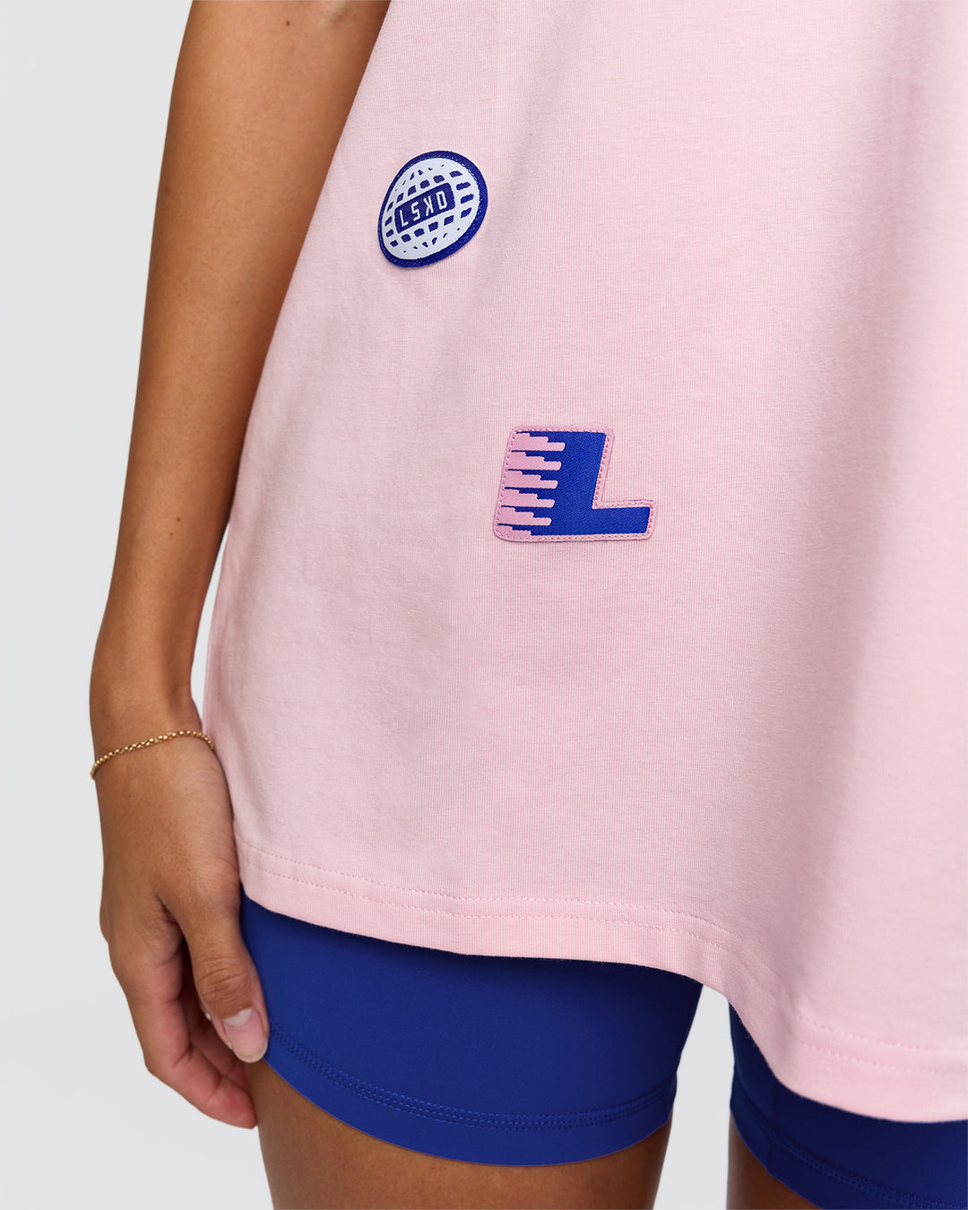 Woman wearing League Heavyweight FLXCotton Oversized Tee - Marshmallow-Power Cobalt | Model:Rhiley | Size:XS - view 11