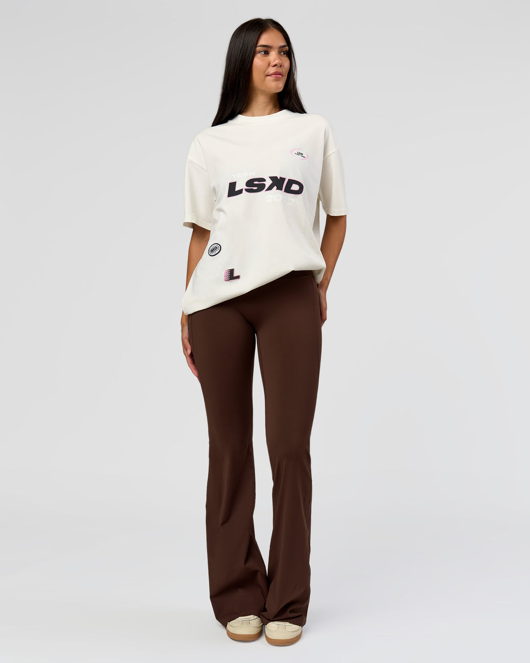 Woman wearing League Heavyweight FLXCotton Oversized Tee - Off White-Ground Coffee | Model:Rhiley | Size:XS - view 3