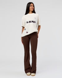 Woman wearing League Heavyweight FLXCotton Oversized Tee - Off White-Ground Coffee | Model:Rhiley | Size:XS | Thumbnail Index: 2