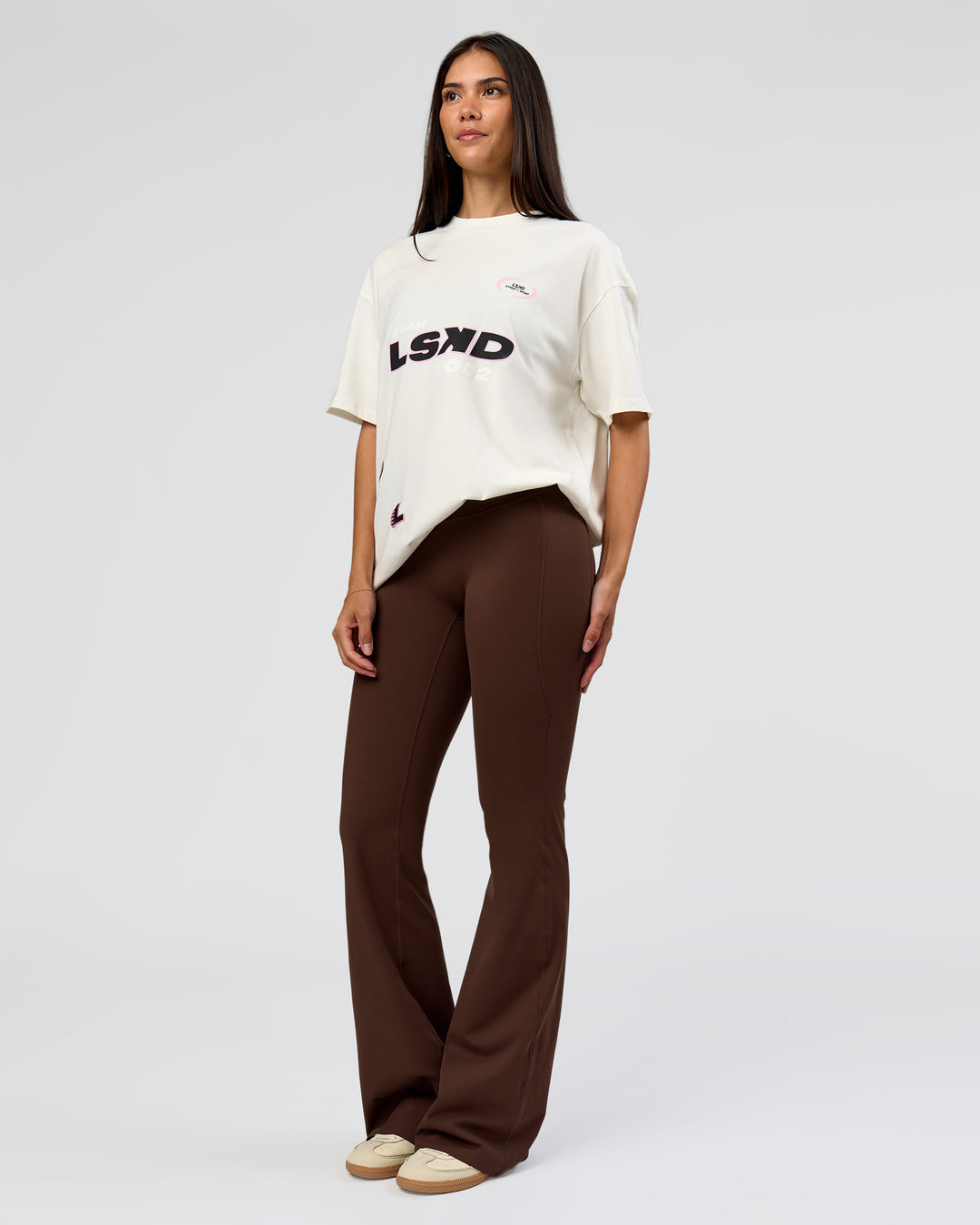 Woman wearing League Heavyweight FLXCotton Oversized Tee - Off White-Ground Coffee | Model:Rhiley | Size:XS - view 6