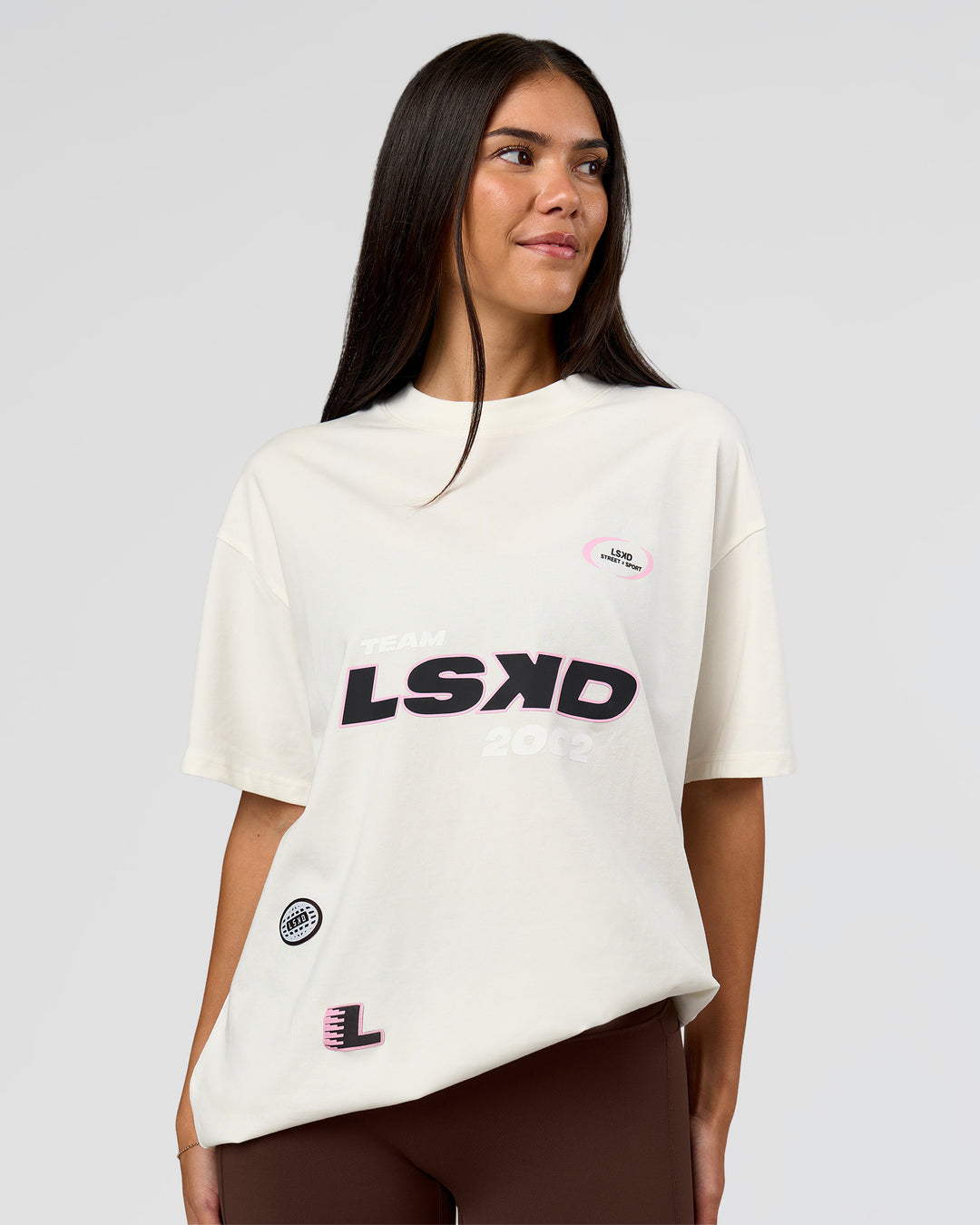 Woman wearing League Heavyweight FLXCotton Oversized Tee - Off White-Ground Coffee | Model:Rhiley | Size:XS - view 9