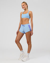 Woman wearing Accelerate 3" Mid-Rise Running Short - Bluebell-Open Air | Model:Taneisha | Size:XS | Thumbnail Index: 1