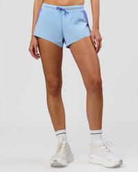 Woman wearing Accelerate 3" Mid-Rise Running Short - Bluebell-Open Air | Model:Taneisha | Size:XS | Thumbnail Index: 9