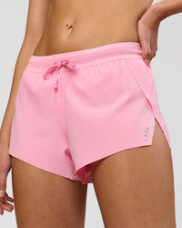 Woman wearing Accelerate 3" Mid-Rise Running Short - Pink Rose | Model:Taneisha | Size:XS | Thumbnail Index: 0