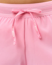 Woman wearing Accelerate 3" Mid-Rise Running Short - Pink Rose | Model:Taneisha | Size:XS | Thumbnail Index: 4