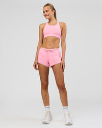 Woman wearing Accelerate 3" Mid-Rise Running Short - Pink Rose | Model:Taneisha | Size:XS | Thumbnail Index: 1