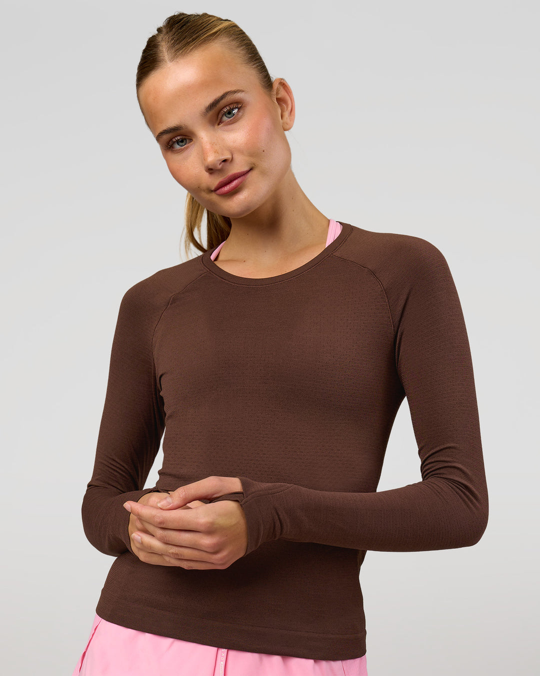 Woman wearing AeroFLX+ Seamless Long Sleeve Tee - Hot Chocolate/Hot Chocolate | Model:Taneisha | Size:XS - view 1