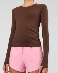 Woman wearing AeroFLX+ Seamless Long Sleeve Tee - Hot Chocolate/Hot Chocolate | Model:Taneisha | Size:XS | Thumbnail Index: 1