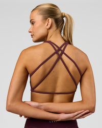 Woman wearing Aspire Sports Bra - Cherry Lacquer | Model:Taneisha | Size:XS | Thumbnail Index: 0