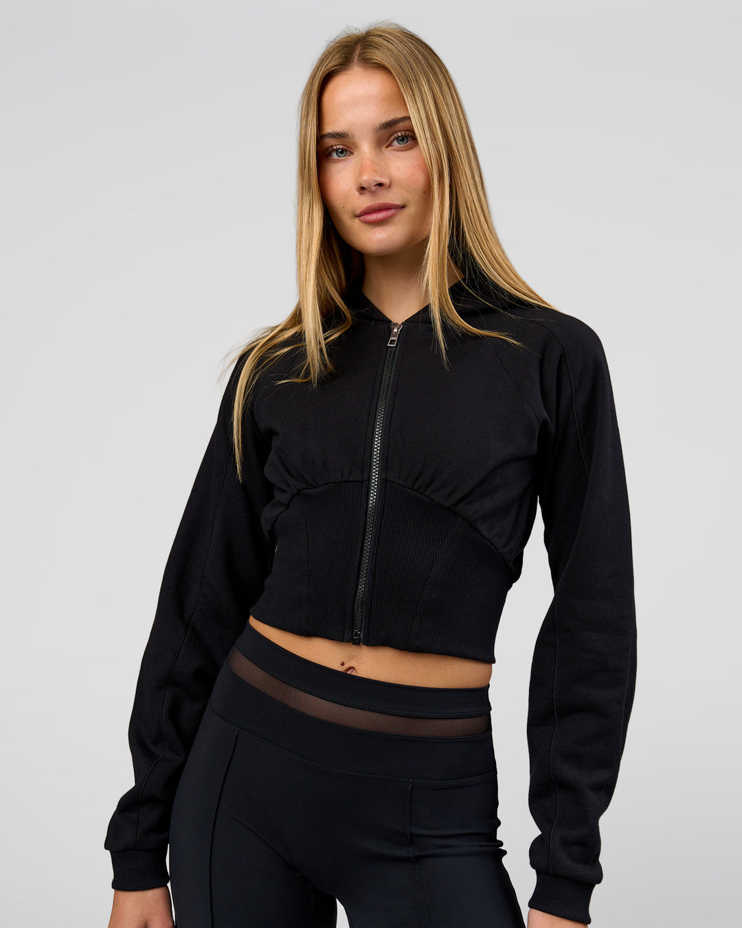 Woman wearing Bend Contour Silhouette Zip Through Hoodie - Black | Model:Taneisha | Size:XS - view 1
