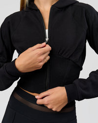 Woman wearing Bend Contour Silhouette Zip Through Hoodie - Black | Model:Taneisha | Size:XS | Thumbnail Index: 1