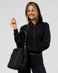 Woman wearing Bend Contour Silhouette Zip Through Hoodie - Black | Model:Taneisha | Size:XS | Thumbnail Index: 2