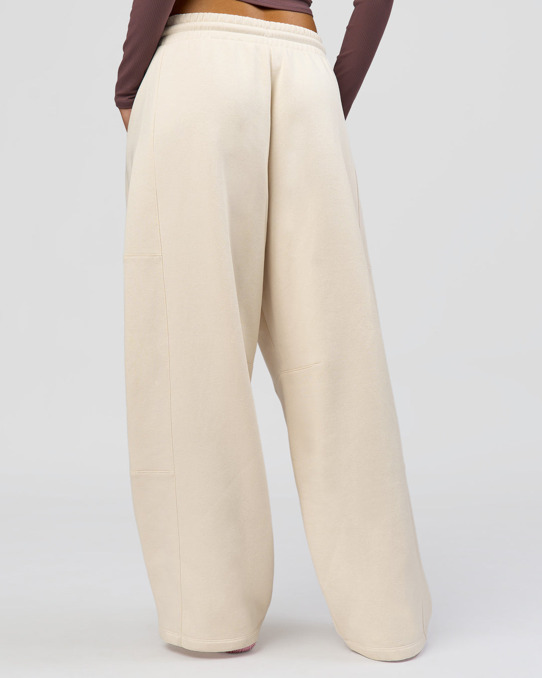 Woman wearing Bree Barrel Fleece Track Pant - Vanilla Bean | Model:Taneisha | Size:XS - view 9