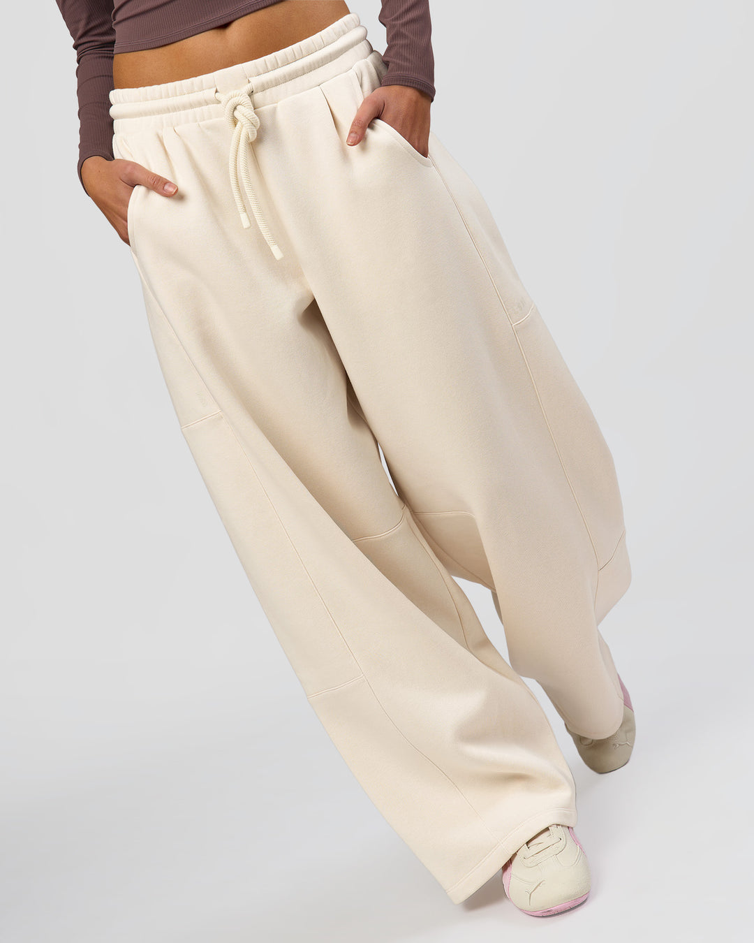 Woman wearing Bree Barrel Fleece Track Pant - Vanilla Bean | Model:Taneisha | Size:XS - view 12