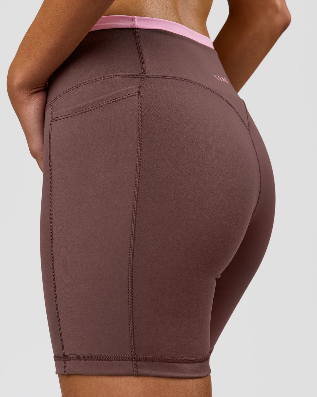Woman wearing Bree Fusion High-Rise 6" Short Pockets - Cocoa Powder-Pink Rose | Model:Taneisha | Size:XS - view 12