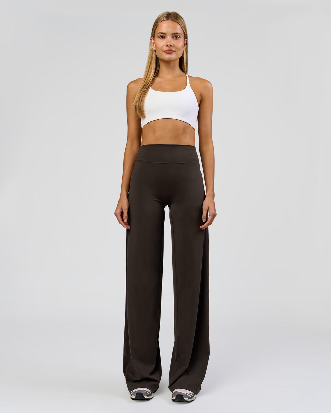 Woman wearing Elixir High-Rise Tall Pant - Ground Coffee | Model:Taneisha | Size:XS - view 1