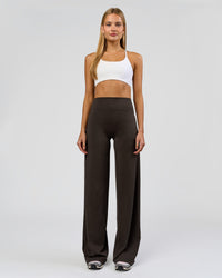 Woman wearing Elixir High-Rise Tall Pant - Ground Coffee | Model:Taneisha | Size:XS | Thumbnail Index: 0