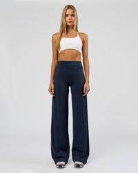 Woman wearing Elixir High-Rise Tall Pant - Midnight Navy | Model:Taneisha | Size:XS | Thumbnail Index: 0