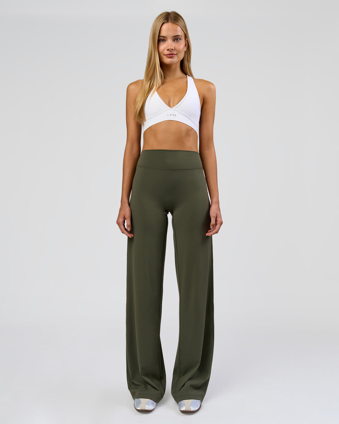 Woman wearing Elixir High-Rise Tall Pant - Pure Olive | Model:Taneisha | Size:XS - view 1