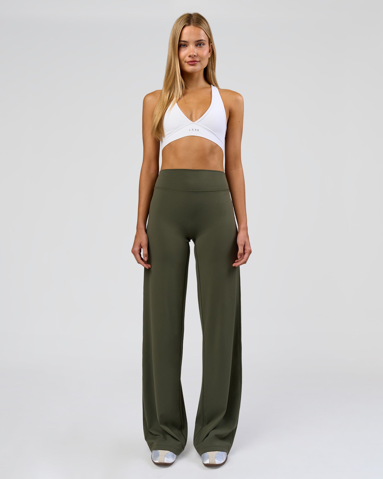 Woman wearing Elixir High-Rise Tall Pant - Pure Olive | Model:Taneisha | Size:XS