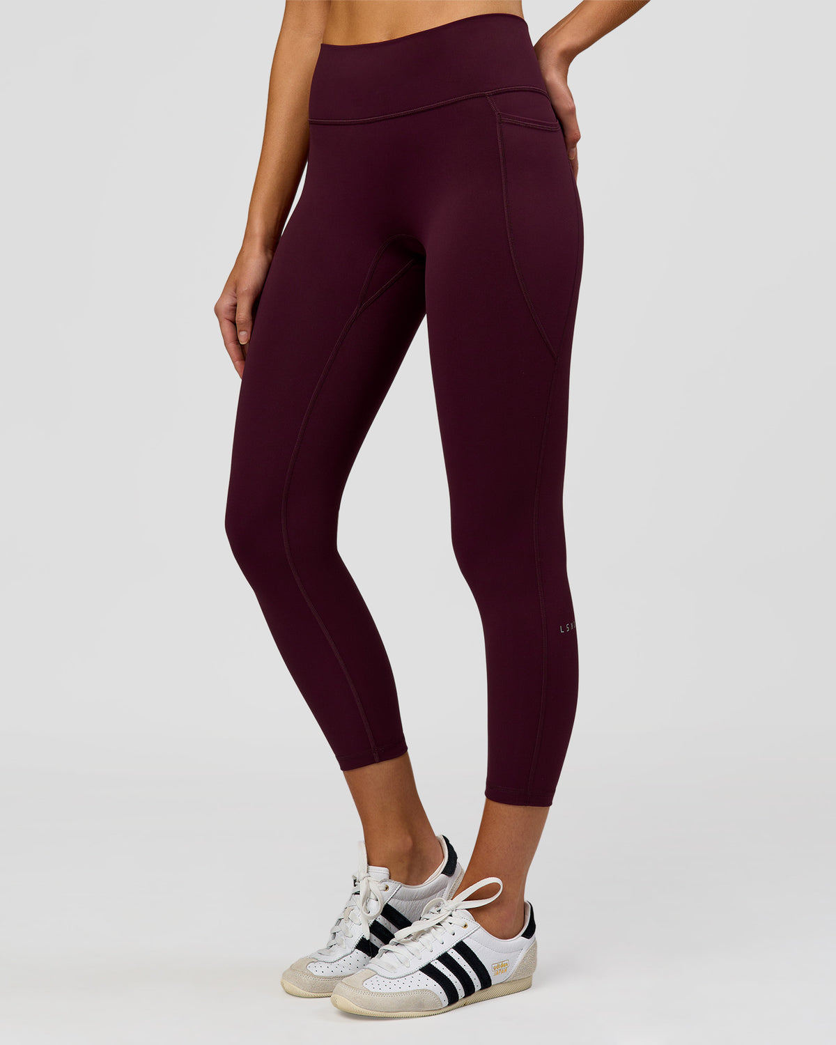 Woman wearing Fusion High-Rise 7/8 Legging Pockets - Cherry Lacquer | Model:Taneisha | Size:XS