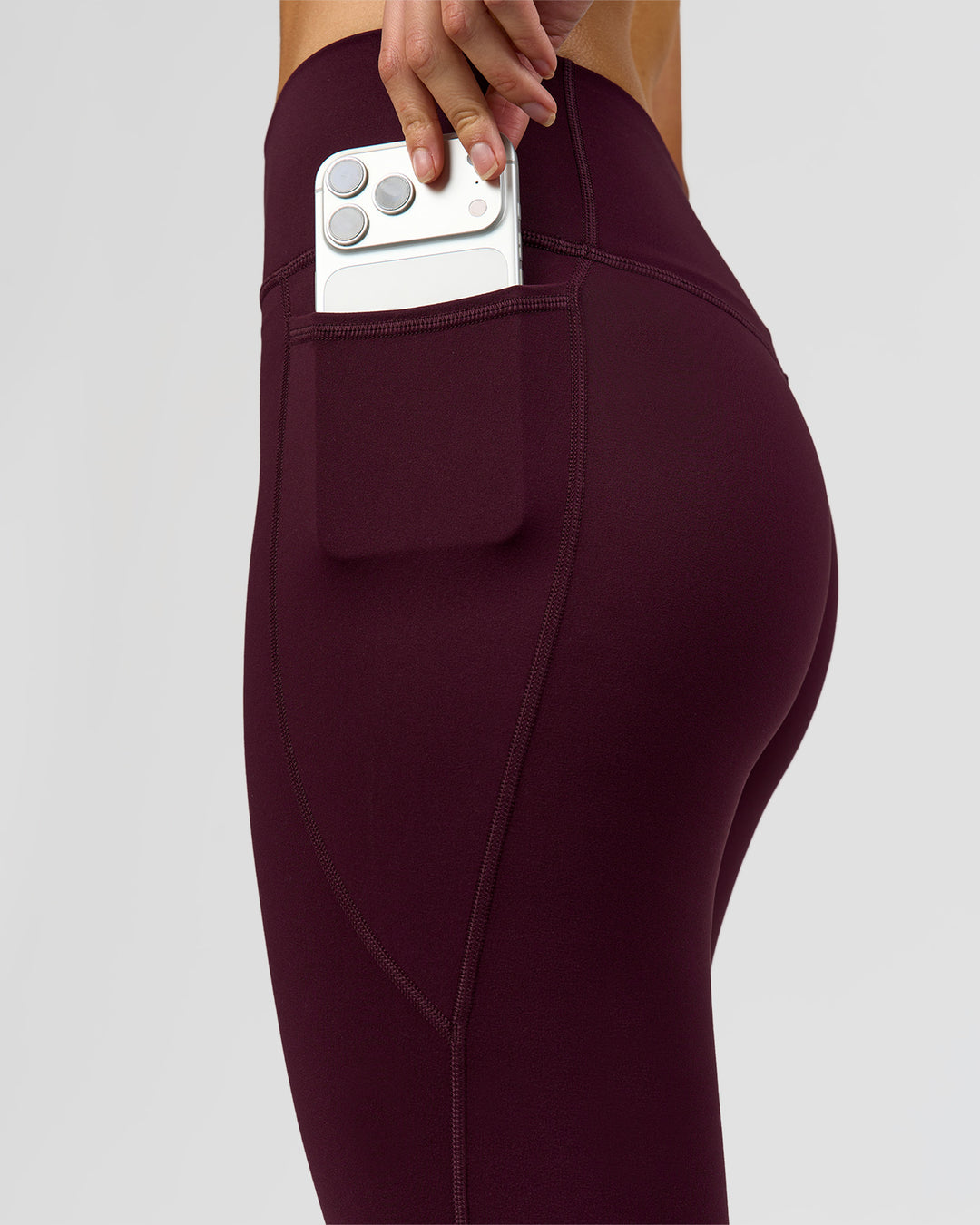 Woman wearing Fusion High-Rise 7/8 Legging Pockets - Cherry Lacquer | Model:Taneisha | Size:XS - view 5